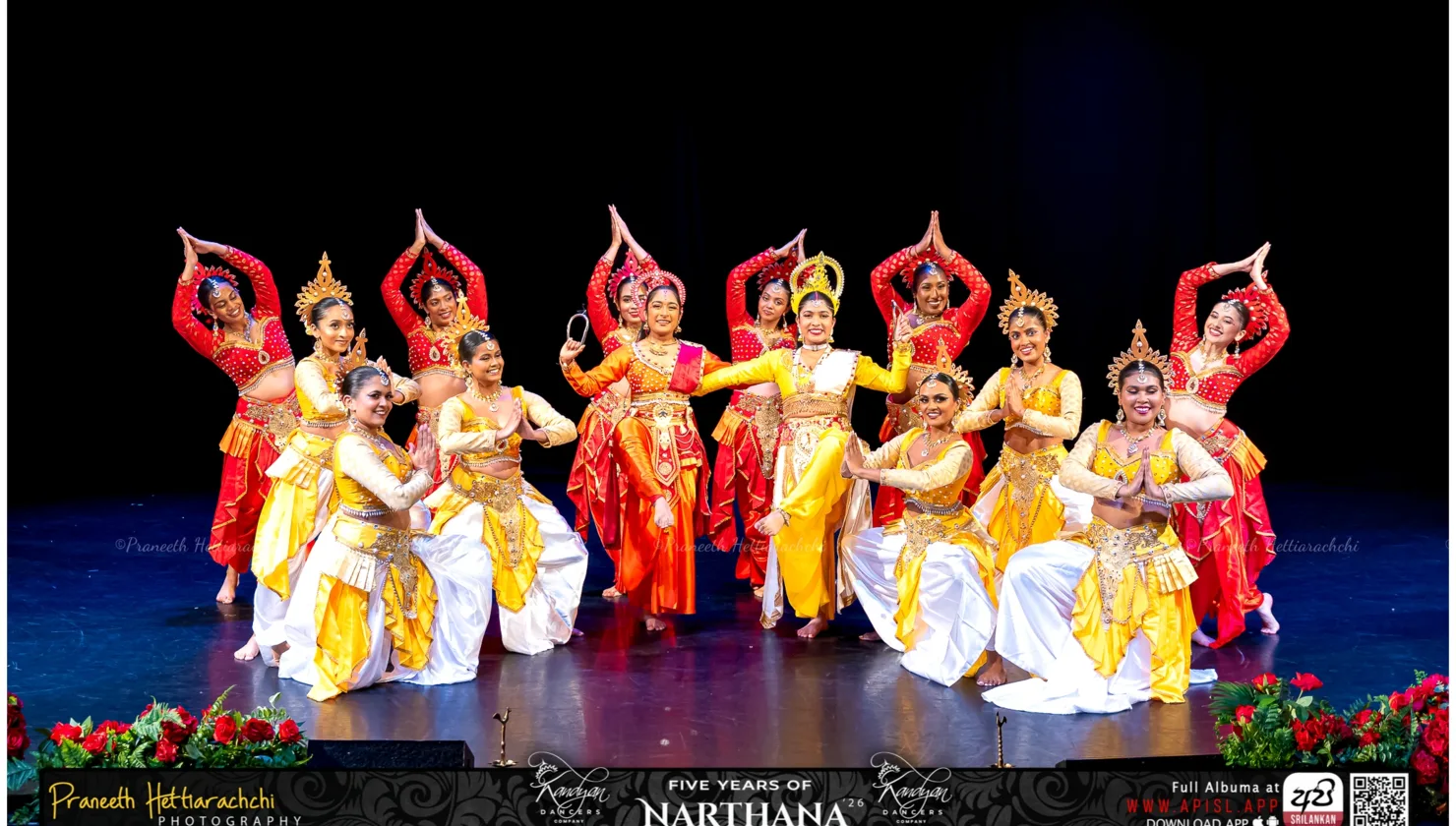 Sri Lankan dancers in colourful traditional costumes performing on stage during Narthana 2026